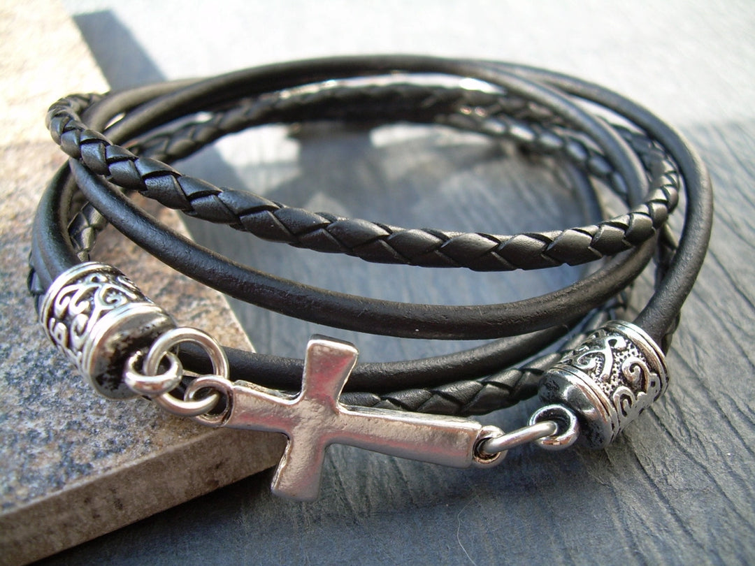 This double strand, Triple wrap, black braided, Leather Cross bracelet. Double strands of 3mm Leather Cord. The secure lobster clasp makes for a quick on and off. A great set of " His and Her" leather bracelets. Available at Buckle and Hide leather in Smyrna, TN.