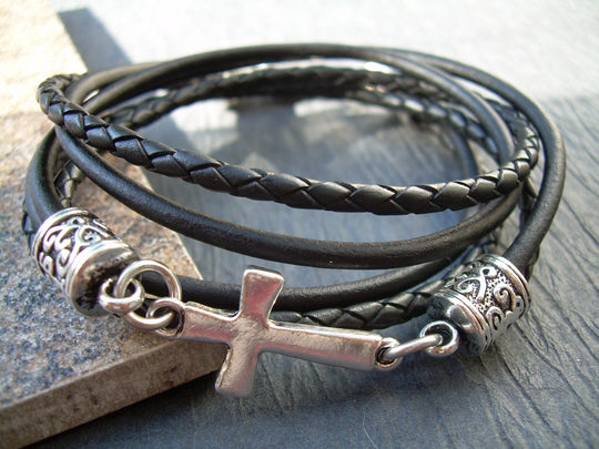 This double strand, Triple wrap, black braided, Leather Cross bracelet. Double strands of 3mm Leather Cord. The secure lobster clasp makes for a quick on and off. A great set of " His and Her" leather bracelets. Available at Buckle and Hide leather in Smyrna, TN.