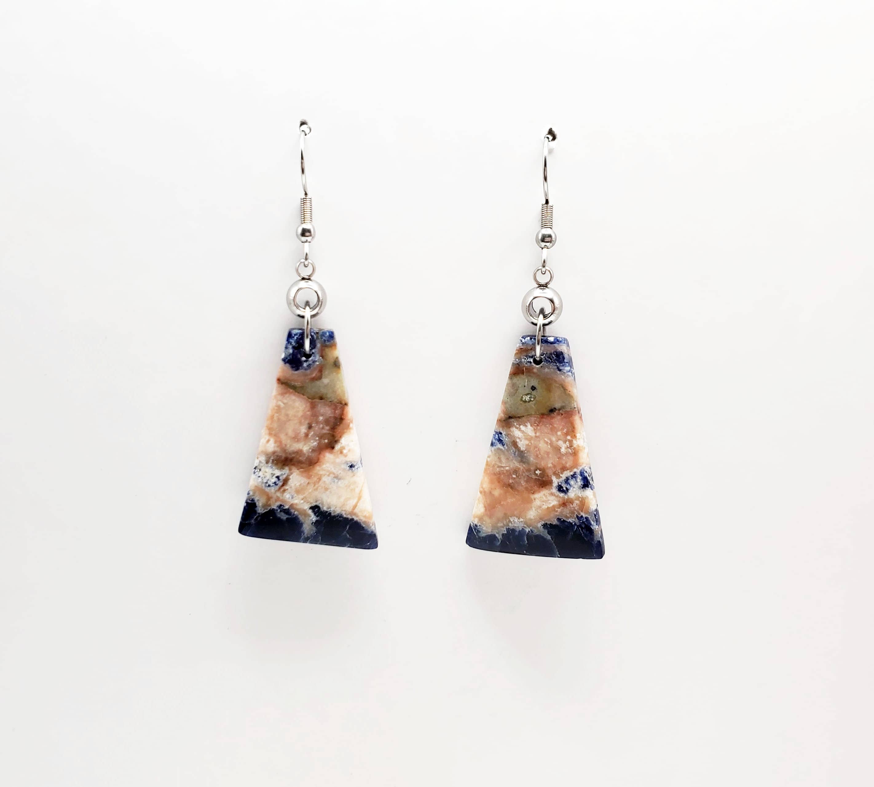 -The earrings are stainless steel with Sodalite stone -The ear wires are stainless steel. -The earrings measure 7/8" wide -They measure 2 1/4" in total length -Medium weight -The earrings pictured are the ones you will receive. They are the only pair like this. Stocked at our Smyrna, TN shop down I-24 from downtown.