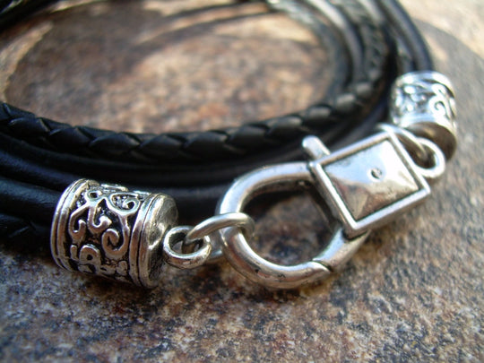 This double strand, Triple wrap, black braided, Leather Cross bracelet. Double strands of 3mm Leather Cord. The secure lobster clasp makes for a quick on and off. A great set of " His and Her" leather bracelets. Available at Buckle and Hide leather in Smyrna, TN.