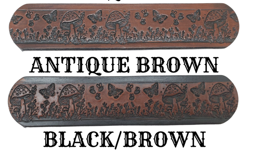 Our 1 1/2" Throwback Groovy Mushroom is a solid strip of USA veg-tan cowhide, embossed with a scene of Mushrooms, Flowers, and Butterflies down length of belt. It is hand finished in&nbsp;3 finishes, with smooth beveled, and painted edges, approx. 1/8" thick. Sizes available are&nbsp;34" to 44" from buckle end to hole most worn.&nbsp; Buckle is an Antique Silver finish brass, held in place with 2 snaps for easy buckle change. Crafted by hand at our Smyrna, Tennessee shop, close to Nashville.