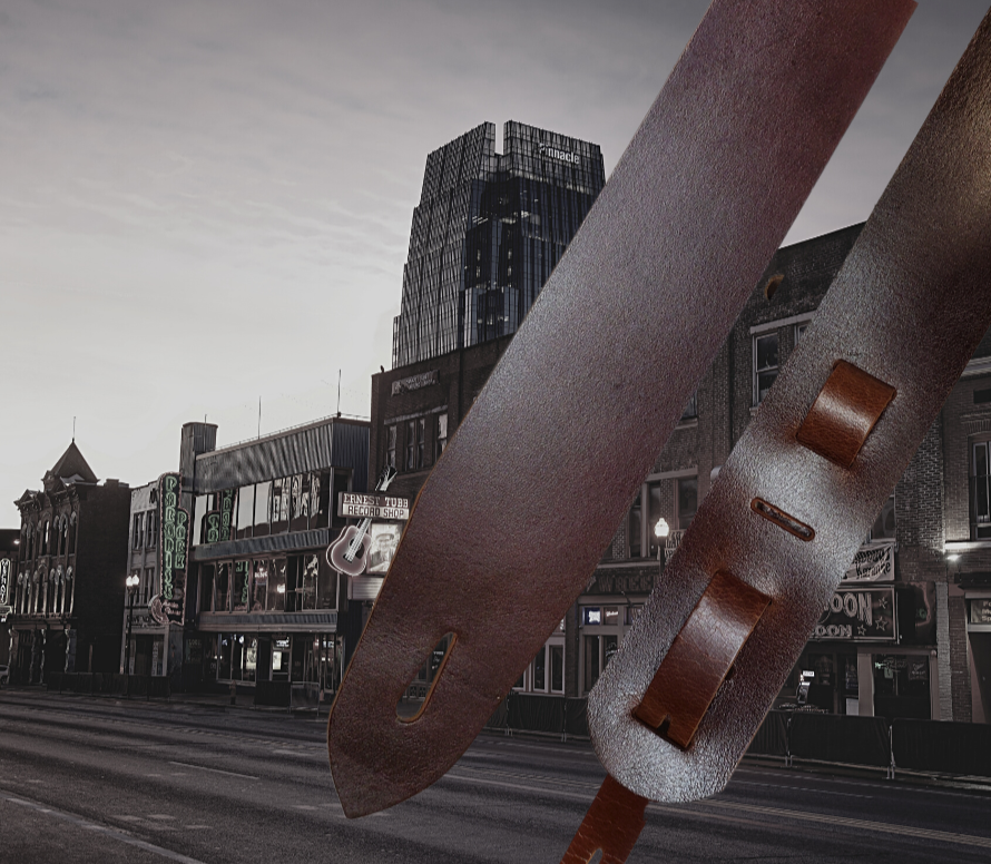 Lower Broadway where so many get their start in the Nashville! Long shifts where you hone your craft & meet players from all backgrounds. "This Basic Brown 2" or 2 1/2" wide Guitar Strap is a nod to playing those Honky Tonks. The strap is approx. 1/8" thick Water Buffalo that will after a few gigs will feel like your old boots. The classic adjustment style goes from approx. 42" to 56". Made just outside Nashville in our Smyrna, TN. shop. 