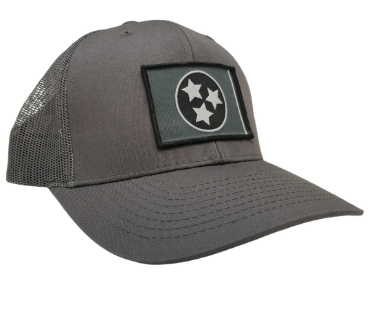 The Three stars on this Structured cap represent the three divisions of Tennessee: West, Middle and East. “They are arranged in such a way that not one star has prominence over the other. Sport your Tennessee support with our grey mesh cap featuring the iconic Tennessee Tri Star flag logo. Shop now at our Smyrna, TN store or online. Snap back adjustment.