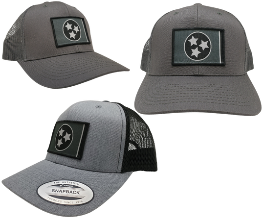 The Three stars on this Structured cap represent the three divisions of Tennessee: West, Middle and East. “They are arranged in such a way that not one star has prominence over the other. Sport your Tennessee support with our grey mesh cap featuring the iconic Tennessee Tri Star flag logo. Shop now at our Smyrna, TN store or online. Snap back adjustment.