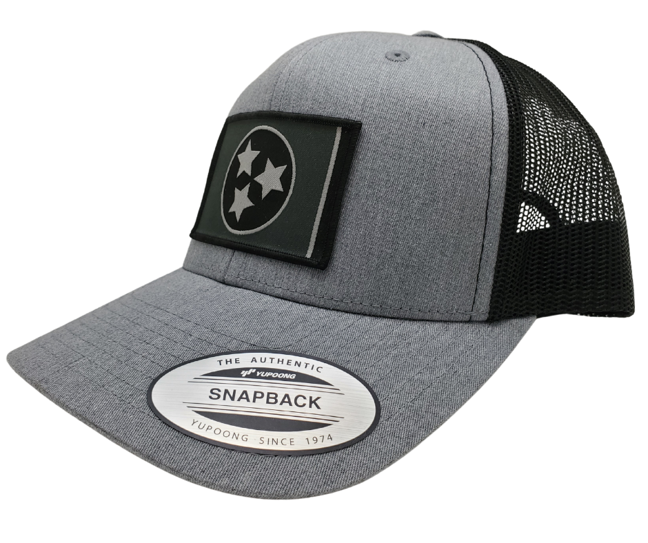 The Three stars on this Structured cap represent the three divisions of Tennessee: West, Middle and East. “They are arranged in such a way that not one star has prominence over the other. Sport your Tennessee support with our grey mesh cap featuring the iconic Tennessee Tri Star flag logo. Shop now at our Smyrna, TN store or online. Snap back adjustment.