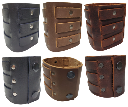 Show off your rocker style with our 2 3/4" Wide Laced Leather Cuff. Featuring three leather strips woven through a broad band, it channels that edgy Zack Wilde vibe. Crafted from soft leather, it promises a comfy fit all day long. Hurry—limited quantities available at our Smyrna, TN store!

PLEASE NOTE SIZING (see picture) SMALL 8", MEDIUM 8 1/2", LARGE 9". Sizing may vary slightly with each cuff.