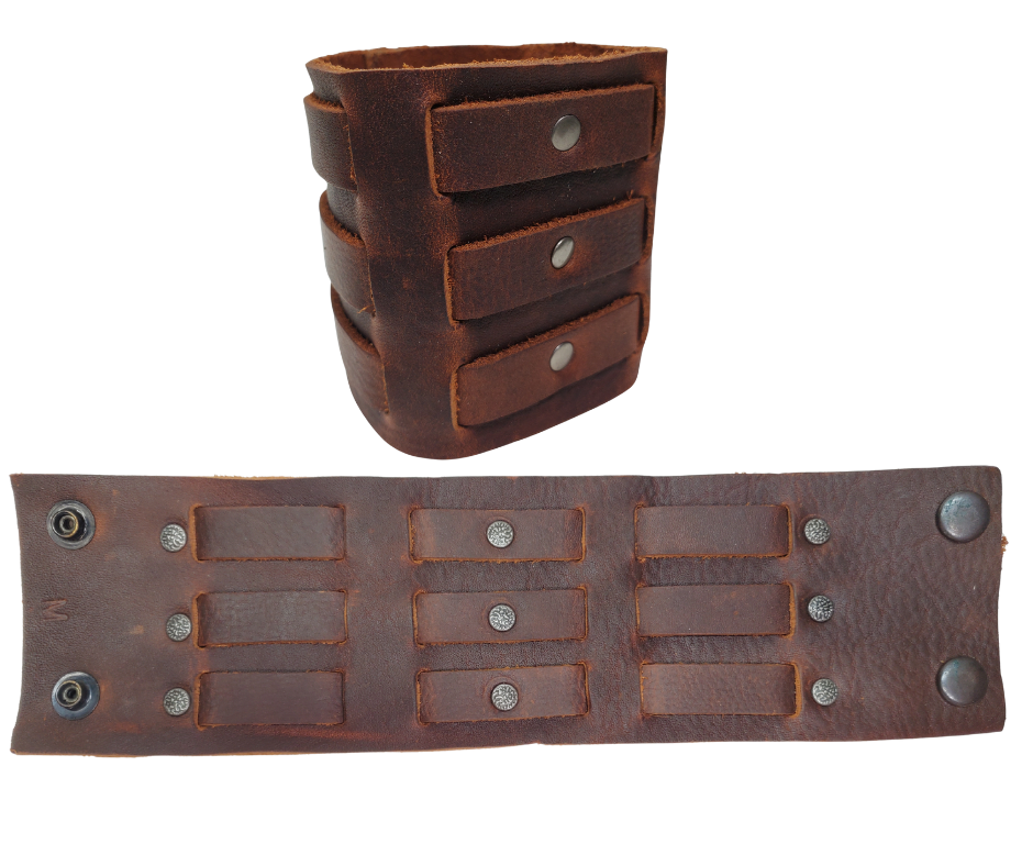 Show off your rocker style with our 2 3/4" Wide Laced Leather Cuff. Featuring three leather strips woven through a broad band, it channels that edgy Zack Wilde vibe. Crafted from soft leather, it promises a comfy fit all day long. Hurry—limited quantities available at our Smyrna, TN store!

PLEASE NOTE SIZING (see picture) SMALL 8", MEDIUM 8 1/2", LARGE 9". Sizing may vary slightly with each cuff.