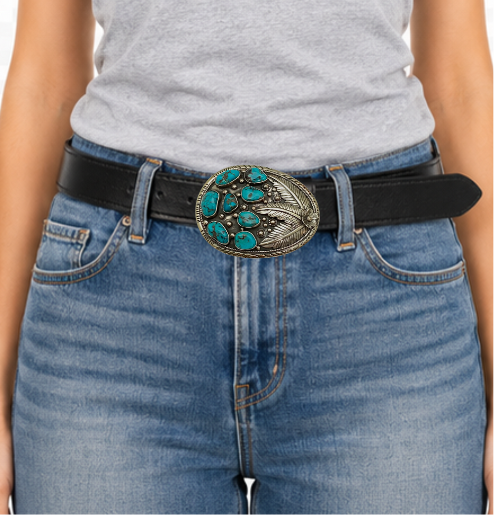 The Navajo influenced Turquoise Sky belt buckle&nbsp; It is crafted from white metal with turquoise and flowers on it and no 2 are alike because of the unique stones in each buckle. The measurement is approx. 3"x 4" and will fit up to 1 1 /2" belts. Ride on to our Smyrna, TN shop and check'em out!

Handcrafted in Nepal.
Floral design back