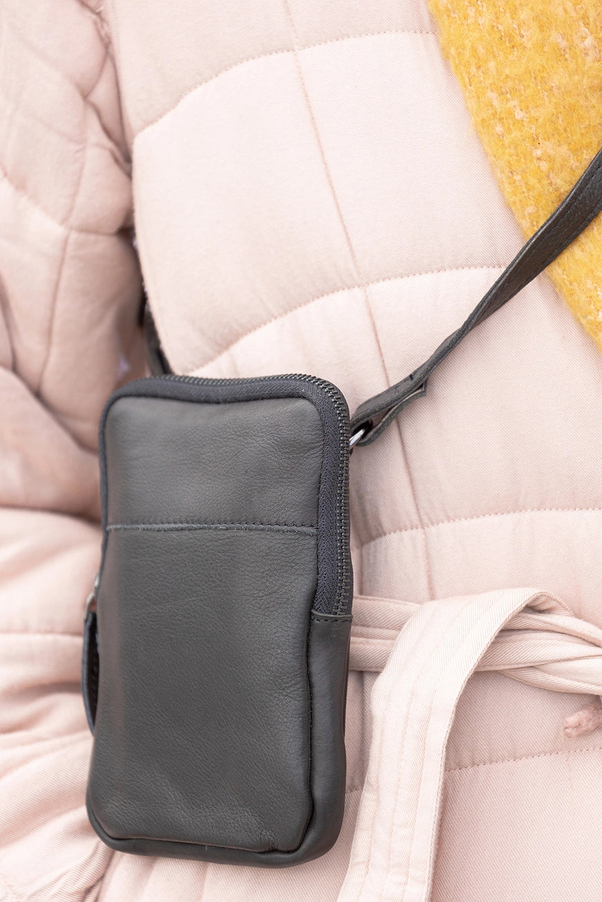 Our IVY Phone Crossbody Bag combines practicality with style. Made of luxurious Nappa leather and featuring high-quality brass hardware, this everyday bag has a unique crossbody design that allows you to keep all your essentials, including your smartphone, in one place. Come check out our local shop in Smyrna, TN, just a short distance from Murfreesboro!