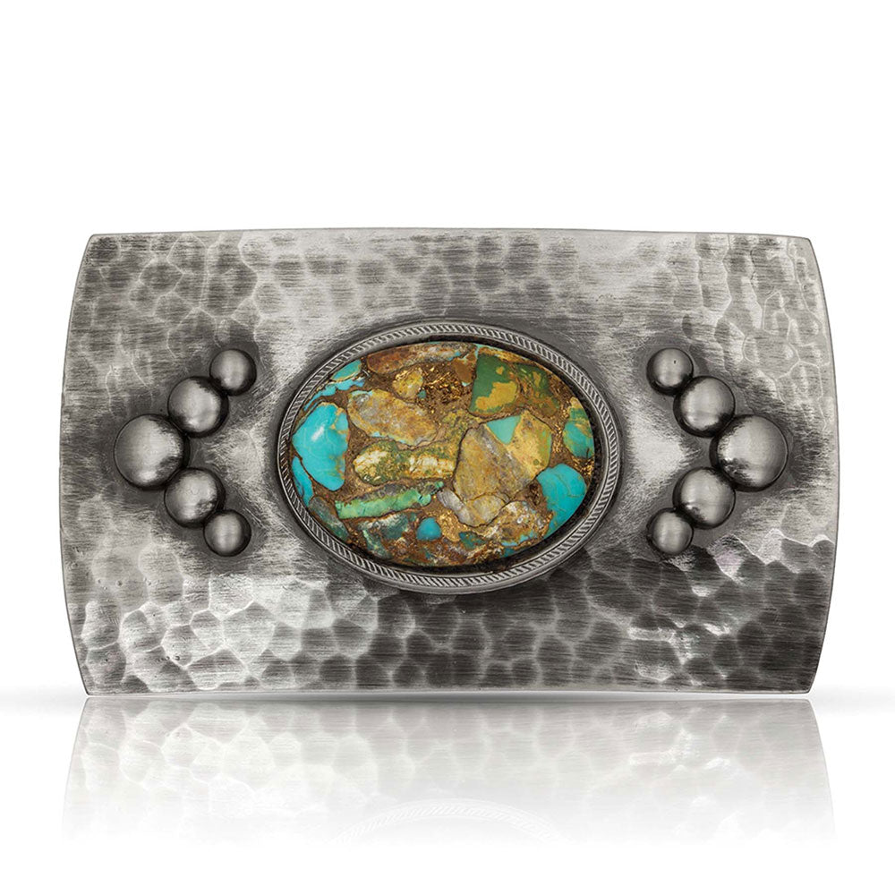 Finally a Southwest buckle that's not so big! This smaller rectangular belt buckle has a hammered textured with a hand-buffed gunmetal finish.  Five high domed beads in a Chevron shape, a large center oval turquoise cabochon. The stone has natural variation to it so each stone will be as individual as the wearer. It's size is approx. 3" across x 2" tall and fits 1 1/2" belts. Available at our Smyrna, TN just a short drive from downtown Nashville.
