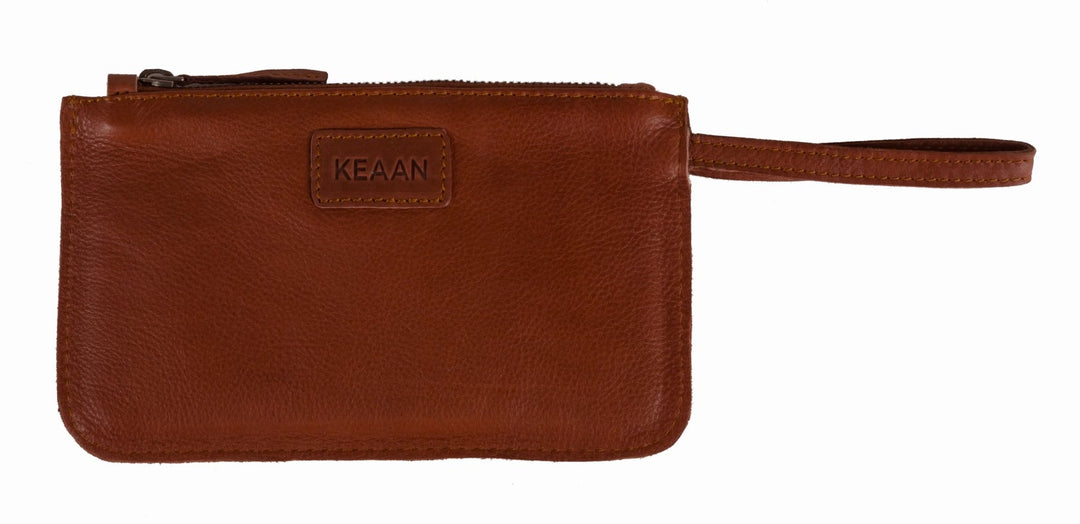 Our Kara wallet is a minimalist, sleek wristlet made from super soft Nappa leather. It can keep all your credit cards, cash, phone, and knick-knacks safely. Also works as a wristlet or keep it in your favorite bag when you have more stuff. Get yours at our world famous Smyrna, TN leather shop a short Uber ride from downtown Nashville.
