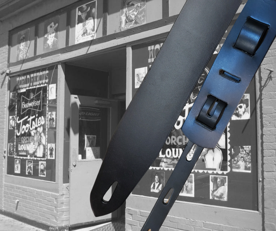 Lower Broadway where so many get their start in the Nashville! Long shifts where you hone your craft and meet players from all backgrounds. "This Basic Black 2" or 2 1/2" wide Guitar Strap is a nod to those playing in the Honky Tonks. The strap is approx. 1/8" thick Cowhide that will after a few gigs will look like your favorite old boots. The classic adjustment style goes from approx. 42" to 56". Made just outside Nashville in our Smyrna, TN. shop.