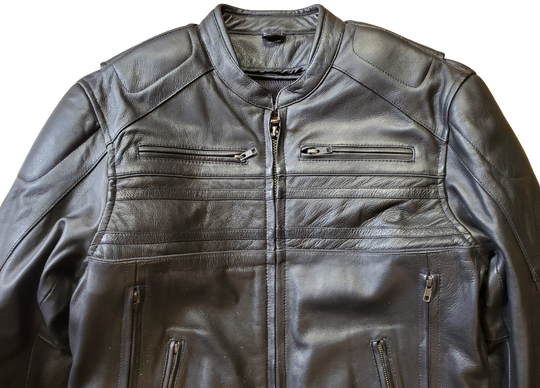 European style collar. It also has decorative black on black stripes and 2 reflective piping strips across front and back. Padding across shoulders, arms, and lower back. Four outside pockets, zippered vents, and two inside concealed carry pockets. The jacket also comes with a full sleeve zip out liner and is available in sizes from M to 5XL. You can find this jacket in stock at our Smyrna, TN shop, only 30 minutes away from downtown Nashville.