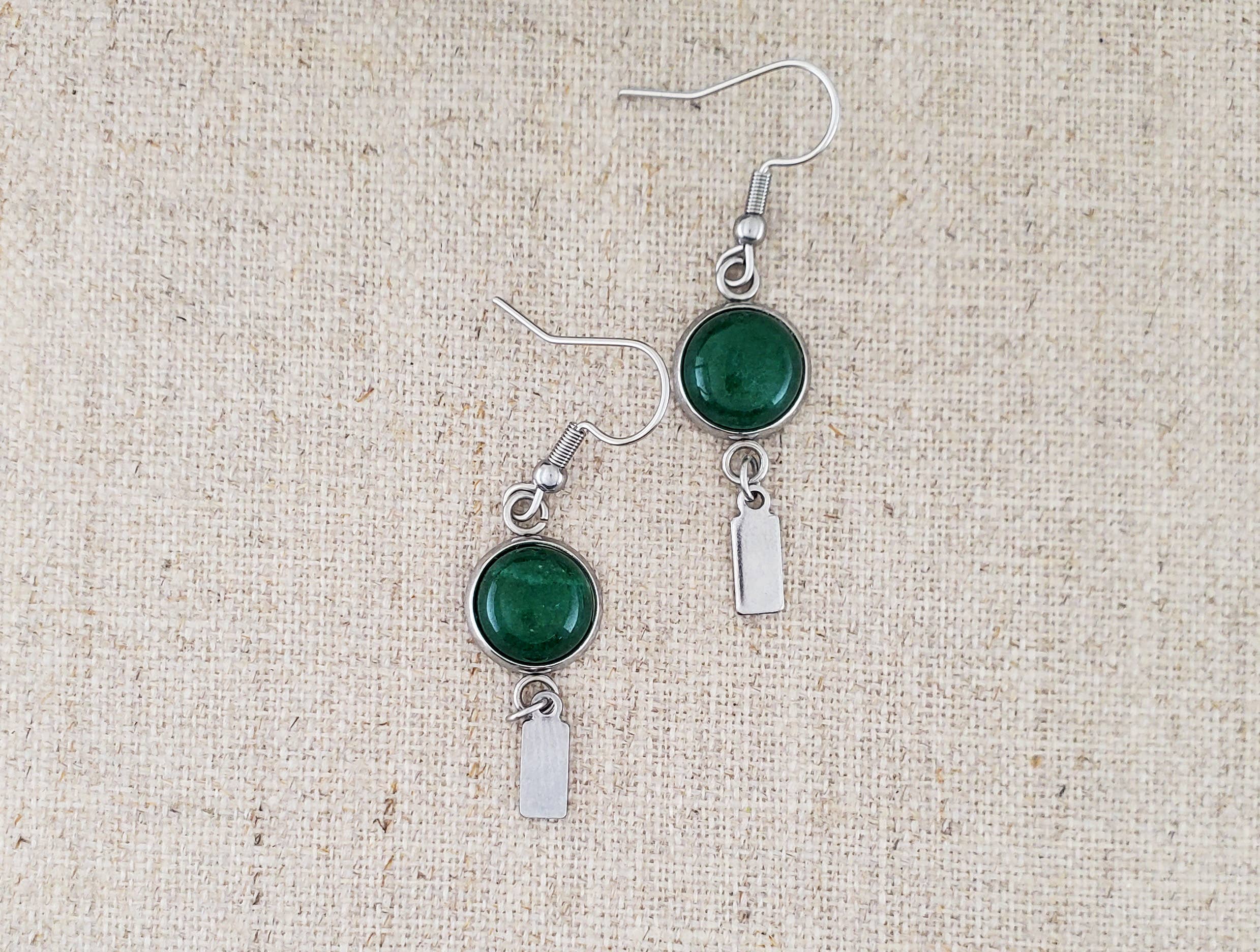 -The earrings are stainless steel with Green Agate stone -The ear wires are stainless steel. -The earrings measure 1/2" wide -They measure 1 7/8" in total length -Light weight -You will receive earrings similar to what is pictured here. Stocked at our Smyrna, TN shop down I-24 from downtown.