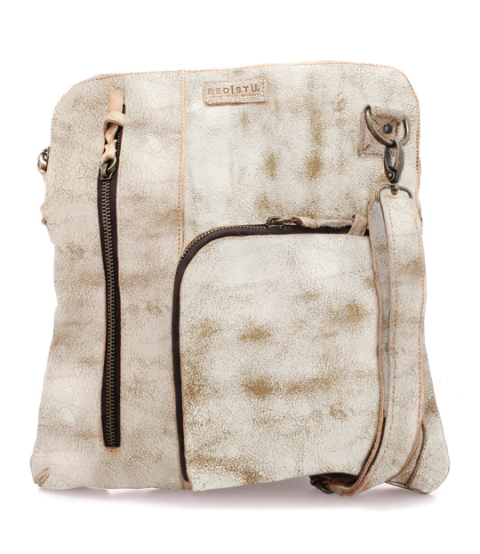 The Aiken is a convertible crossbody bag made from Artisan veg-tanned leather.  Secure metal zip-top closure, and 3 exterior zip pockets, all with security tabs. One pocket is conveniently placed on the front with credit card and pen slots. An adjustable crossbody strap is removable to switch up bag’s rotation. Aiken is organic cotton lined with 2 slip pockets inside and one larger zippered pocket. 
12L x 13H x 1W
Handmade in Leon, Mexico
Made by Bed/Stu. Stocked in our Smyrna, TN shop.