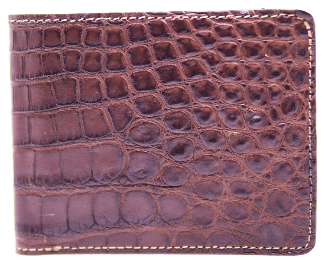 If you appreciate Hi-end craftmanship this USA Made Genuine Alligator in slight Matte Brown. Matching Alligator inside Lining with 1 Bill Pocket, 8 Card Slots, 2 Inner Side Pockets. Each hide and wallet is unique! Handmade in USA and sold in our Smyrna, TN shop not far from the gulch downtown Nashville.

Thin profile