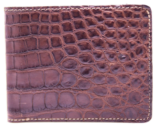 If you appreciate Hi-end craftmanship this USA Made Genuine Alligator in slight Matte Brown. Matching Alligator inside Lining with 1 Bill Pocket, 8 Card Slots, 2 Inner Side Pockets. Each hide and wallet is unique! Handmade in USA and sold in our Smyrna, TN shop not far from the gulch downtown Nashville.

Thin profile