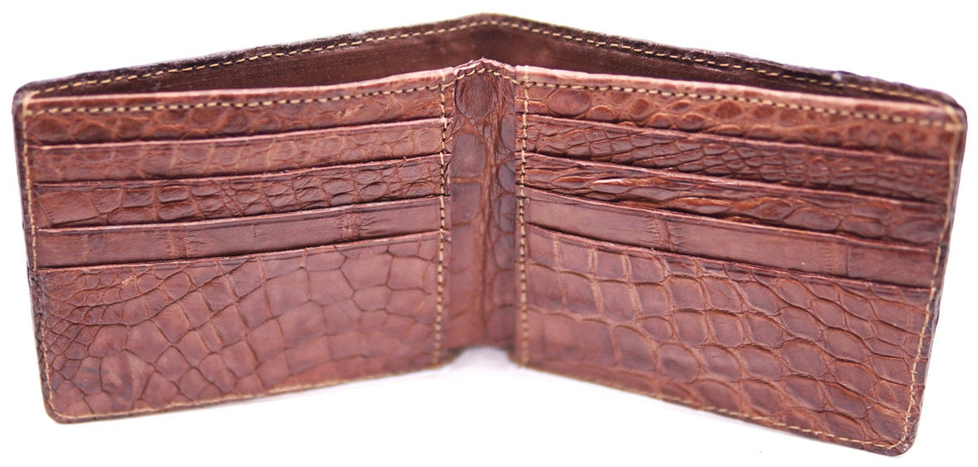 If you appreciate Hi-end craftmanship this USA Made Genuine Alligator in slight Matte Brown. Matching Alligator inside Lining with 1 Bill Pocket, 8 Card Slots, 2 Inner Side Pockets. Each hide and wallet is unique! Handmade in USA and sold in our Smyrna, TN shop not far from the gulch downtown Nashville.

Thin profile