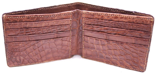 If you appreciate Hi-end craftmanship this USA Made Genuine Alligator in slight Matte Brown. Matching Alligator inside Lining with 1 Bill Pocket, 8 Card Slots, 2 Inner Side Pockets. Each hide and wallet is unique! Handmade in USA and sold in our Smyrna, TN shop not far from the gulch downtown Nashville.

Thin profile