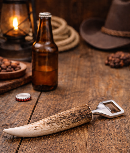 Handcrafted Antler Bottle Opener with high quality stainless steel. Approximate size: 8" in length Made from naturally shed elk and deer antlers. Sizes, colors and shape will vary. Made in the U.S.A. Get yours at our Smyrna, TN shop not far from Franklin.