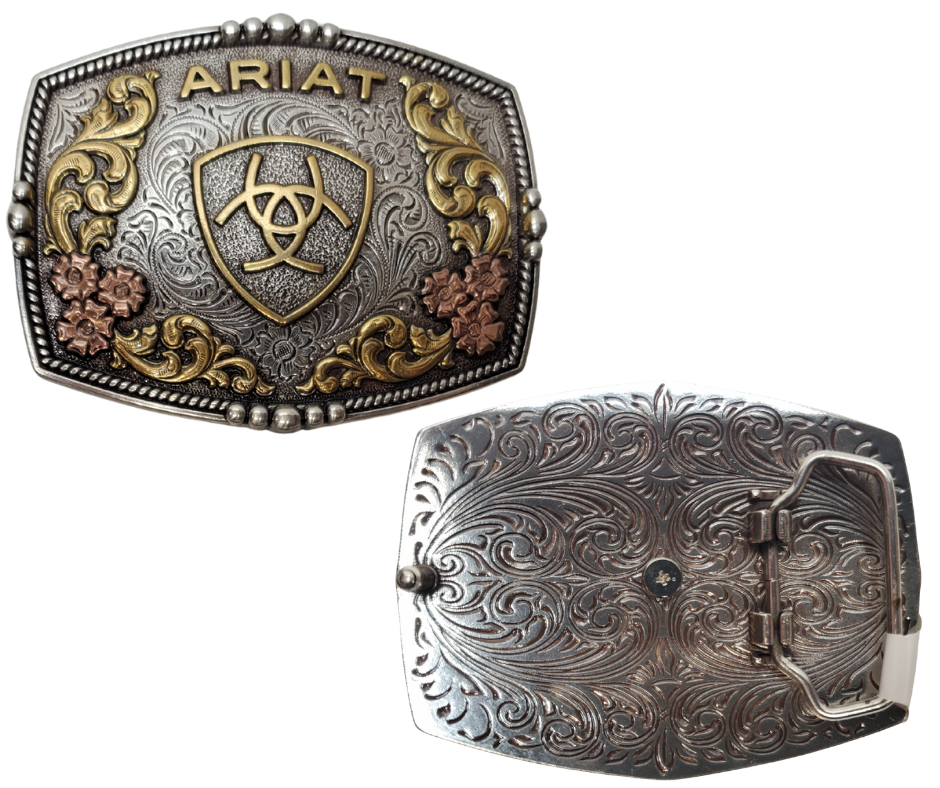 Ariat logo centered in the center and written across the top. Surface also has Classic Western Tri-Color scroll and flower designs and rope design with beads and rope around the border of the buckle. Color is antique silver with brass and bronze accents. Measures about 2 3/4" tall by 3 1/2" wide. Fits belts up to 1 3/4" wide. Available for purchase in our online store or the retail shop in Smyrna, TN, just outside Nashville. Imported
