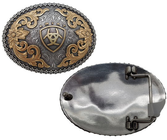This beautiful oval buckle from Ariat features an ornate edge and an Antique and Brass colored Western scroll design surrounding the iconic Ariat logo. It's 3" tall by 4" wide and can fit belts up to 1 1/2" wide. You can find it at our retail shop in Smyrna, TN, near Nashville, or purchase it from our online store.