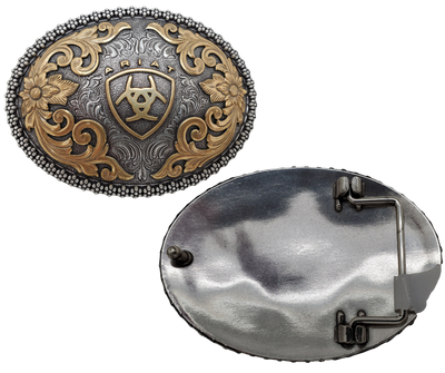 This beautiful oval buckle from Ariat features an ornate edge and an Antique and Brass colored Western scroll design surrounding the iconic Ariat logo. It's 3" tall by 4" wide and can fit belts up to 1 1/2" wide. You can find it at our retail shop in Smyrna, TN, near Nashville, or purchase it from our online store.