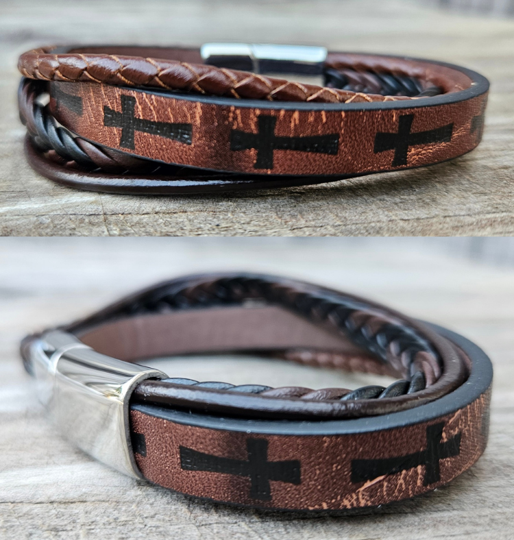 Multi leather strand bracelet with a easy connecting magnetic clasp. Wear everyday or just when your hanging out with friends getting coffee. The Cross is a symbol of deliverance that you can state your faith in a simple way. "We believe" too at our Smyrna, TN shop not far from Salvation By Grace church.

Approx. 8" Length