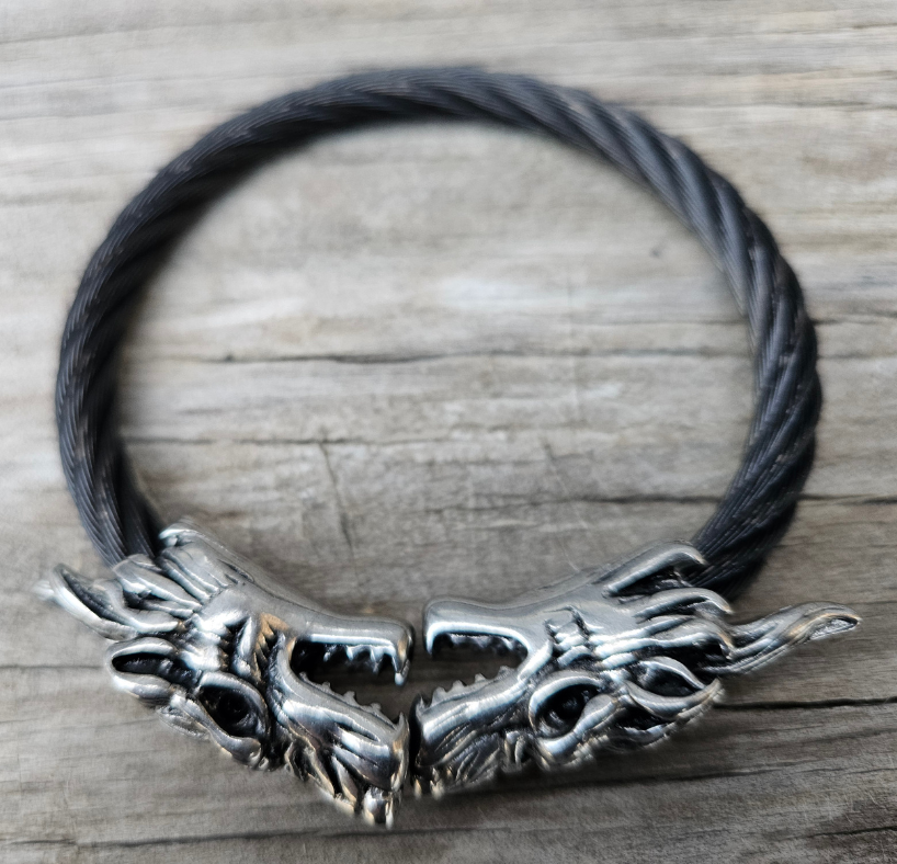 Stainless Steel Wolf head combined with a Black Steel Cable will get you noticed no matter where you are. Durable Stainless Steel last for years. Get yours now at our Smyrna, TN shop not far from Murfreesboro.

Approx. 8" with Wolf heads touching
Adjustable/Flexible cable