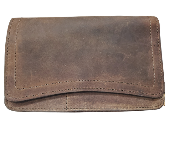 The Aubry leather handbag is available at our Smyrna, TN shop not far from Nashville. The main compartment zips closed, is lined with a sturdy fabric & has 5 inside card slots. Two stacked open pockets, a zippered pocket followed by 2 more slit pockets on the very front. All gets covered by a large flap with a magnetic clasp. On the backside of this organizers dream is yet another open pocket held in place with a narrow piece of leather with a magnetic closure.
Bag size: 8.5” x5” x 2”
54" adjustable strap 