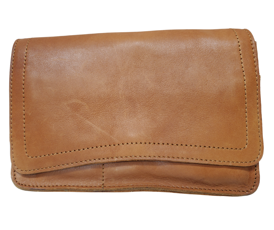 The Aubry leather handbag is available at our Smyrna, TN shop not far from Nashville. The main compartment zips closed, is lined with a sturdy fabric & has 5 inside card slots. Two stacked open pockets, a zippered pocket followed by 2 more slit pockets on the very front. All gets covered by a large flap with a magnetic clasp. On the backside of this organizers dream is yet another open pocket held in place with a narrow piece of leather with a magnetic closure.
Bag size: 8.5” x5” x 2”
54" adjustable strap 