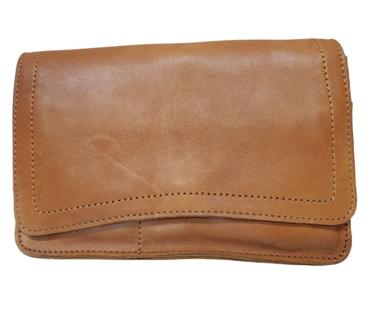 The Aubry leather handbag is available at our Smyrna, TN shop not far from Nashville. The main compartment zips closed, is lined with a sturdy fabric & has 5 inside card slots. Two stacked open pockets, a zippered pocket followed by 2 more slit pockets on the very front. All gets covered by a large flap with a magnetic clasp. On the backside of this organizers dream is yet another open pocket held in place with a narrow piece of leather with a magnetic closure.
Bag size: 8.5” x5” x 2”
54" adjustable strap 