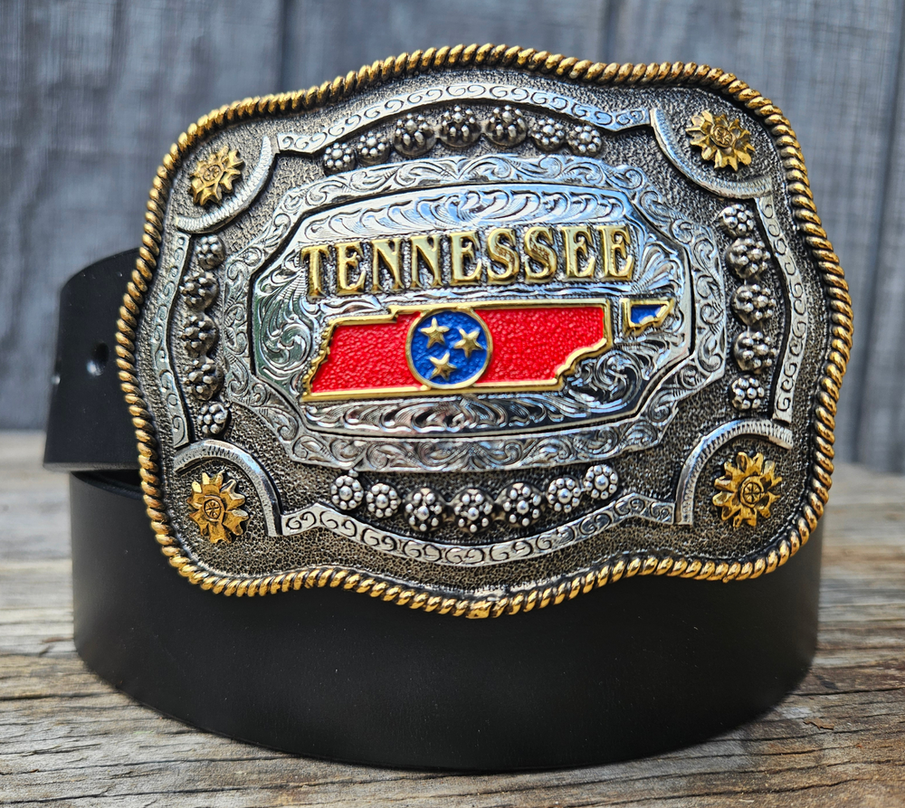 This Tennessee State Belt with Buckle Combo features a 1 1/2" strap. Choose color: Distressed Brown or Black. The edges are beveled and finished. Available lengths from 34" to 44". The buckle is an Antiqued brass colored Tennessee State Buckle snapped in place. Belt is handmade in our shop in Smyrna, TN, just outside of Nashville.