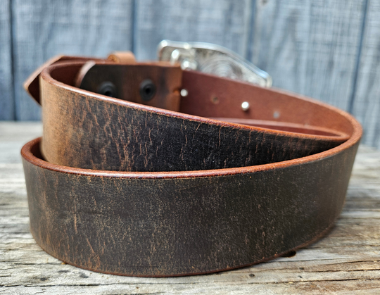 This Tennessee State Flag Belt with Buckle Combo features a 1 1/2" strap. Choose color: Distressed Brown or Black. The edges are beveled and finished. Available lengths from 34" to 44". The buckle is an Antiqued brass colored Tennessee State Buckle snapped in place. Belt is handmade in our shop in Smyrna, TN, just outside of Nashville.