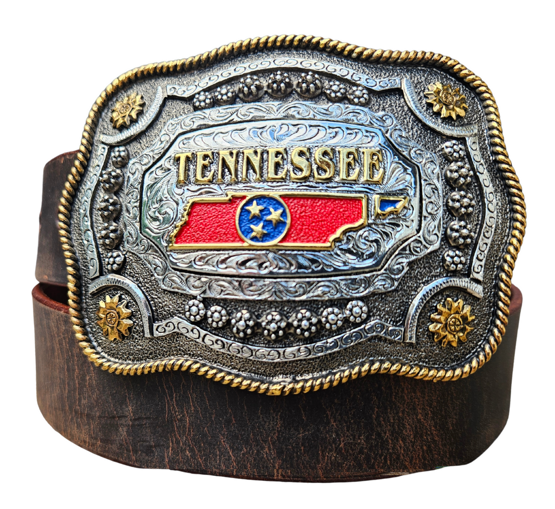 This Tennessee State Belt with Buckle Combo features a 1 1/2" strap. Choose color: Distressed Brown or Black. The edges are beveled and finished. Available lengths from 34" to 44". The buckle is an Antiqued brass colored Tennessee State Buckle snapped in place. Belt is handmade in our shop in Smyrna, TN, just outside of Nashville.