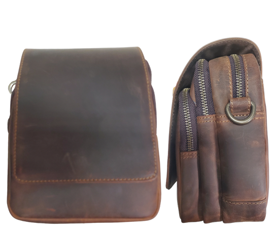 The Pamala Crossbody has 3 zippered compartments and a detachable strap. The small pocket is open, the middle section has 2 pen slots, 1 small pocket, the large pocket has 1 extra zippered pocket. The Flap is secured with a magnetic clasp. It also may slipped on a belt. Currently in stock at our Smyrna, TN shop a rideshare away from Murfreesboro.