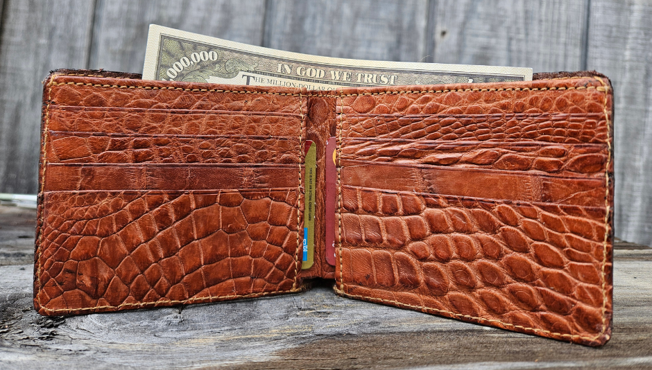 If you appreciate Hi-end craftmanship this USA Made Genuine Alligator in slight Matte Brown. Matching Alligator inside Lining with 1 Bill Pocket, 8 Card Slots, 2 Inner Side Pockets. Each hide and wallet is unique! Handmade in USA and sold in our Smyrna, TN shop not far from the gulch downtown Nashville.

Thin profile