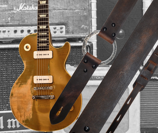 Great Musicians, Singers and great songs have been a staple for years in Nashville. Be on your way starting your journey with this  Vintage styled 1 3/4" "main Body of the Guitar strap is approx. 1/8" thick with a Scroll pattern stainless steel ring. Choose solid Black or Distressed Brown. The classic adjustment style goes from approx. 42" to 56" at it's longest . Made just outside Nashville in our Smyrna, TN. shop. It will need a bit of time to "break in" but will get a great patina over time. 