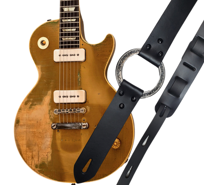 Great Musicians, Singers and great songs have been a staple for years in Nashville. Be on your way starting your journey with this  Vintage styled 1 3/4" "main Body of the Guitar strap is approx. 1/8" thick with a Scroll pattern stainless steel ring. Choose solid Black or Distressed Brown. The classic adjustment style goes from approx. 42" to 56" at it's longest . Made just outside Nashville in our Smyrna, TN. shop. It will need a bit of time to "break in" but will get a great patina over time. 