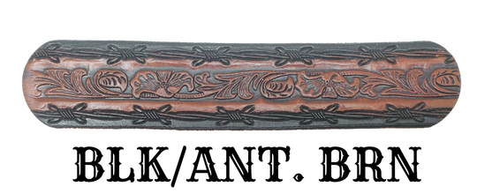 The "Bandit" Name Belt is perfect for those seeking an epic escape. It's handcrafted in Smyrna, Tennessee, just outside Nashville, and features a 1 1/2" width with a strip of vegetable tanned leather. The bold design includes an embossed Barbwire border and Western Scroll center pattern, while the changeable solid brass buckle in antique nickel finish adds a rugged touch. Make your escape in style with this hand-stained belt.