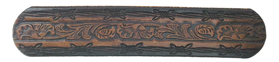 The "Bandit" Name Belt is perfect for those seeking an epic escape. It's handcrafted in Smyrna, Tennessee, just outside Nashville, and features a 1 1/2" width with a strip of vegetable tanned leather. The bold design includes an embossed Barbwire border and Western Scroll center pattern, while the changeable solid brass buckle in antique nickel finish adds a rugged touch. Make your escape in style with this hand-stained belt.