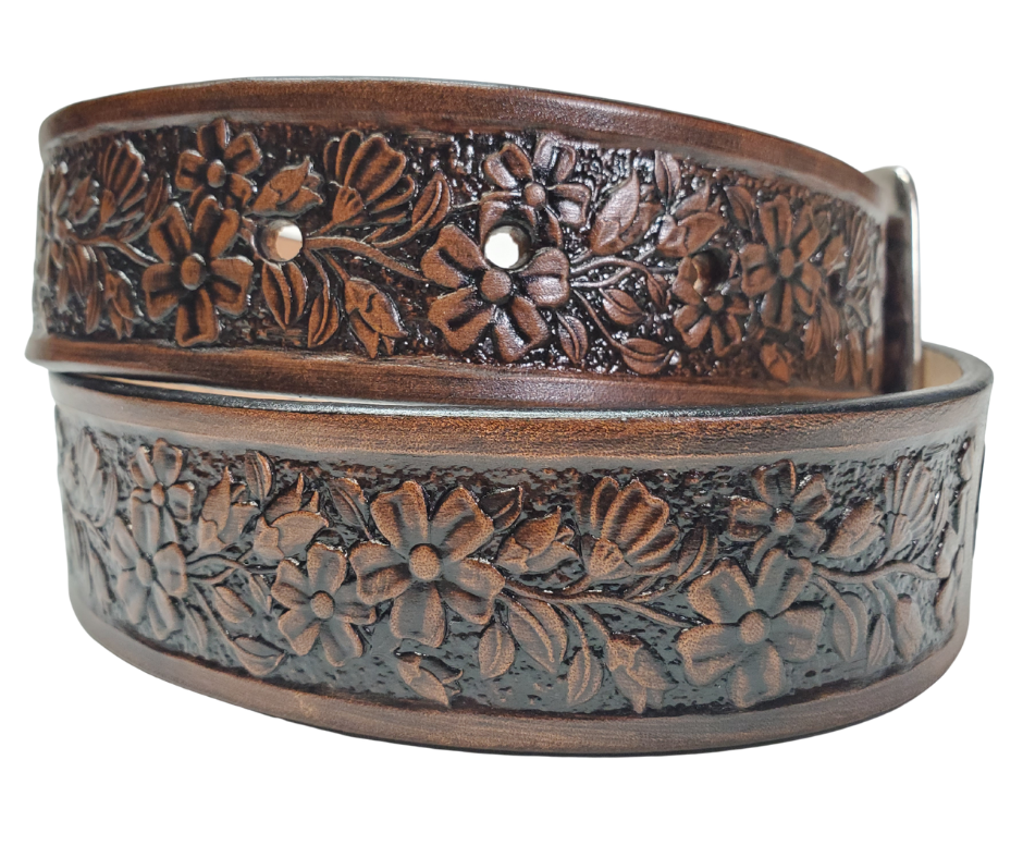 "The Beulah Land" is a handmade real leather belt made from a single strip of cowhide shoulder leather that is 8-10 oz. or approx. 1/8" thick. It has hand burnished (smoothed) edges and summer flowers embossed in 3 color options.  The antique nickel plated solid brass buckle is snapped in place with heavy snaps.  This belt is made just outside Nashville in Smyrna, TN.