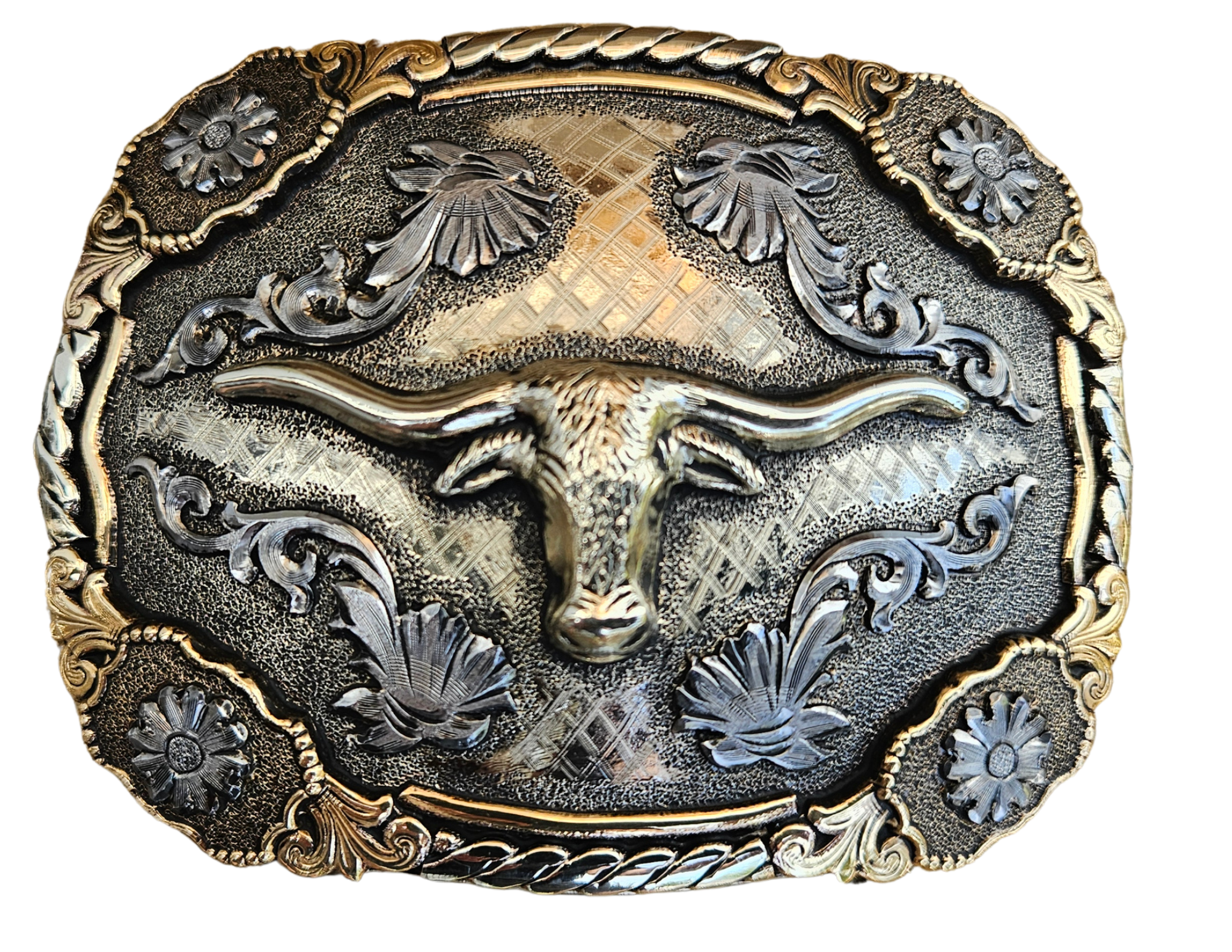 The Bessie Moo Belt Buckle has the ever classic Longhorn design accented with a multi Western scrolls, a hint of Rope on the edge with 4 Flower rosettes. A Classic Western belt buckle at it's best! Made from German Silver and engraved and layered metals in a tri-color Western design. Available in our Smyrna, TN shop, a short distance from Nashville.

Dimensions: Width 4”, Height 2.7”
Standard 1.5” Swivel