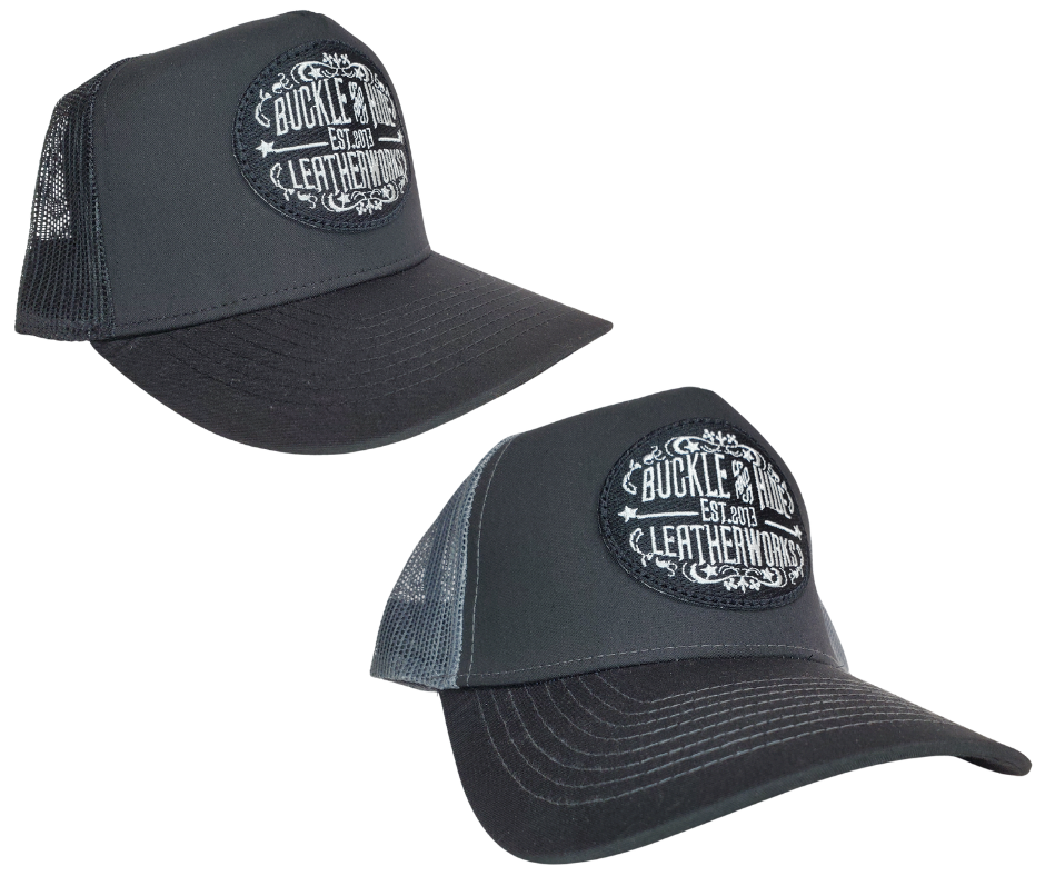 Upgrade your cap game with the Buckle and Hide Classic Trucker Cap. It boasts a fashionable mesh back, structured top, and a convenient snap back closure. The cap comes in Black, Gray/Black with the iconic Buckle and Hide patch on the front. Get yours now from our popular leather shop in Smyrna, TN, just outside of Nashville.