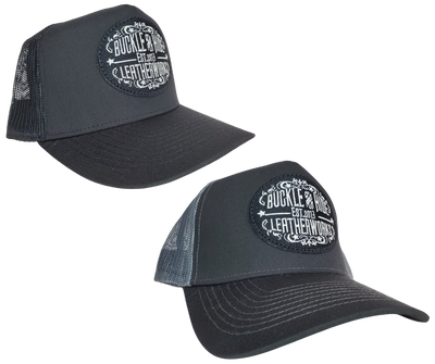 Upgrade your cap game with the Buckle and Hide Classic Trucker Cap. It boasts a fashionable mesh back, structured top, and a convenient snap back closure. The cap comes in Black, Gray/Black with the iconic Buckle and Hide patch on the front. Get yours now from our popular leather shop in Smyrna, TN, just outside of Nashville.