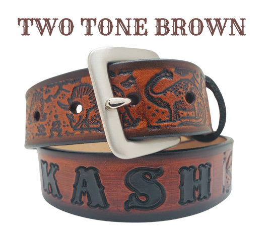 Our Lil Dino is perfect who love Dinosaurs! Full grain American vegetable tanned cowhide approx. 1/8"thick. Width is 1 1/4" and includes Antique Nickle plated Solid Brass buckle. We Hand Finish with each belt. Edges are smooth burnished painted edges. Made in our Smyrna, TN, USA shop. Buckle snaps in place for easy changing if desired.  Choose with or without name