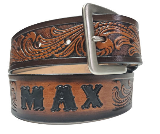 Our Patriot" Name Leather Belt is Full grain American vegetable tanned cowhide approx. 1/8"thick.&nbsp;Width 1 1/2" and includes Antique Nickle plated Solid Brass buckle. Hand Finished with Smooth burnished painted edges. Choose with or without name, if without name, design will cover entire length of belt. For name Type name desired on belt in "Type Name Here" section, no more than 10 letters maximum. Buckle snaps in place for easy changing if desired. Made in our Smyrna, TN, USA shop.