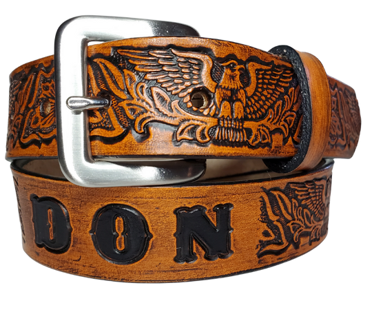 Our Patriot" Name Leather Belt is Full grain American vegetable tanned cowhide approx. 1/8"thick.&nbsp;Width 1 1/2" and includes Antique Nickle plated Solid Brass buckle. Hand Finished with Smooth burnished painted edges. Choose with or without name, if without name, design will cover entire length of belt. For name Type name desired on belt in "Type Name Here" section, no more than 10 letters maximum. Buckle snaps in place for easy changing if desired. Made in our Smyrna, TN, USA shop.