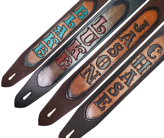 This Classic style 2 1/2" wide Guitar Strap is a nod to that classic influence. The Body of the strap is approx. 1/8" thick Leather Strap with a LEATHER NAME PATCH with Large 1 1/2" Letters. The adjustment style goes from approx. 42" to 56" at it's longest . Made just outside Nashville in our Smyrna, TN. shop. It will need a bit of time to "break in" but will get a great patina over time.