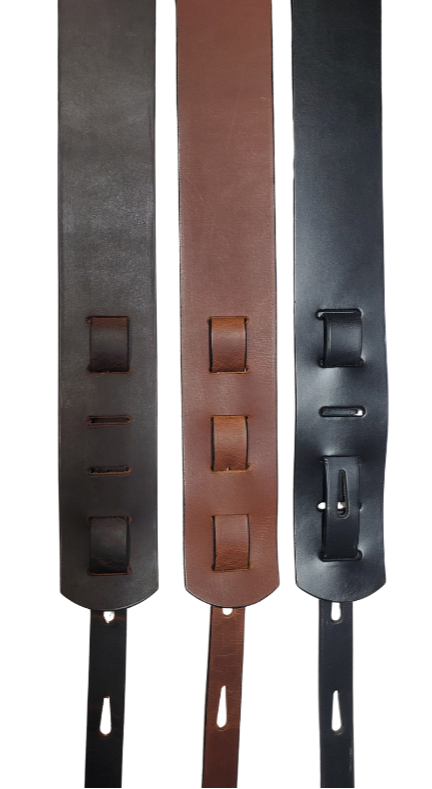 This Classic style 2 1/2" wide Guitar Strap is a nod to that classic influence. The Body of the strap is approx. 1/8" thick Leather Strap with a LEATHER NAME PATCH with Large 1 1/2" Letters. The adjustment style goes from approx. 42" to 56" at it's longest . Made just outside Nashville in our Smyrna, TN. shop. It will need a bit of time to "break in" but will get a great patina over time.